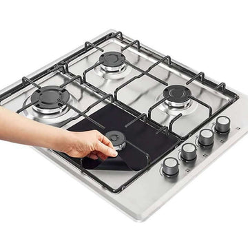 Kitchen Knives & Accessories - stainless steel gas cooktop with four burners and control knobs, hand cleaning black glass center panel