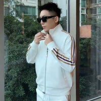Affordable Luxury Patchwork Striped Casual Sports Suit High-End Stand-Up Collar Jacket And Pants Two-Piece Set on man in white jacket